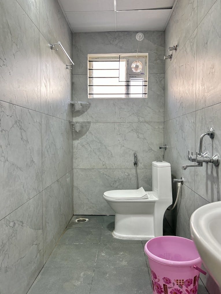 Attached bathroom at Infinity Space PG, Yeshwanthpur, Bengaluru